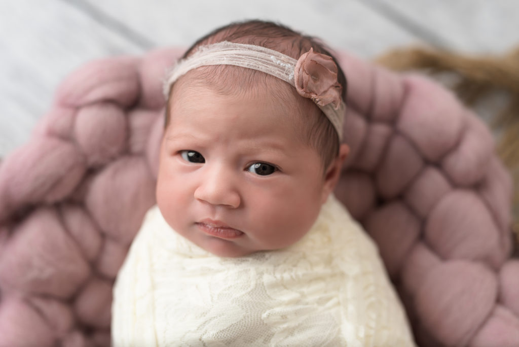 Open eyed baby girl photography