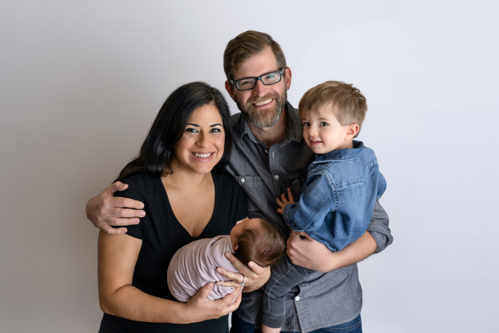 happy family with new baby girl newborn photography session