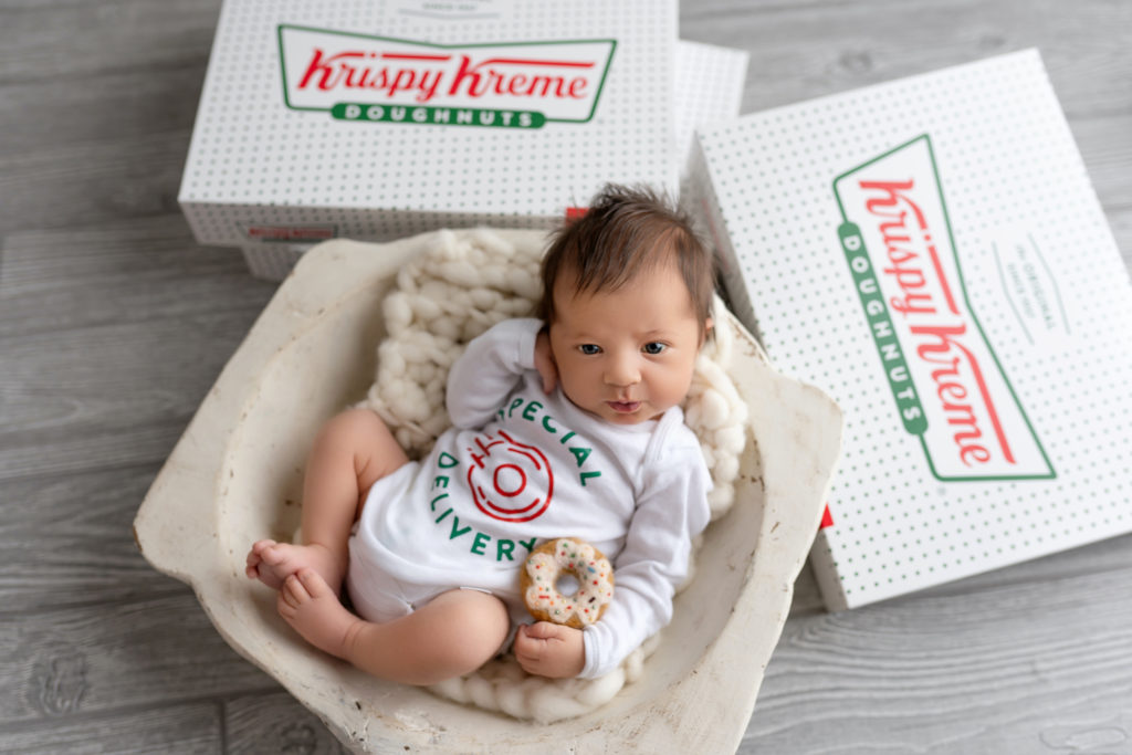 krispy kreme doughnuts baby special delivery newborn posed baby with donut