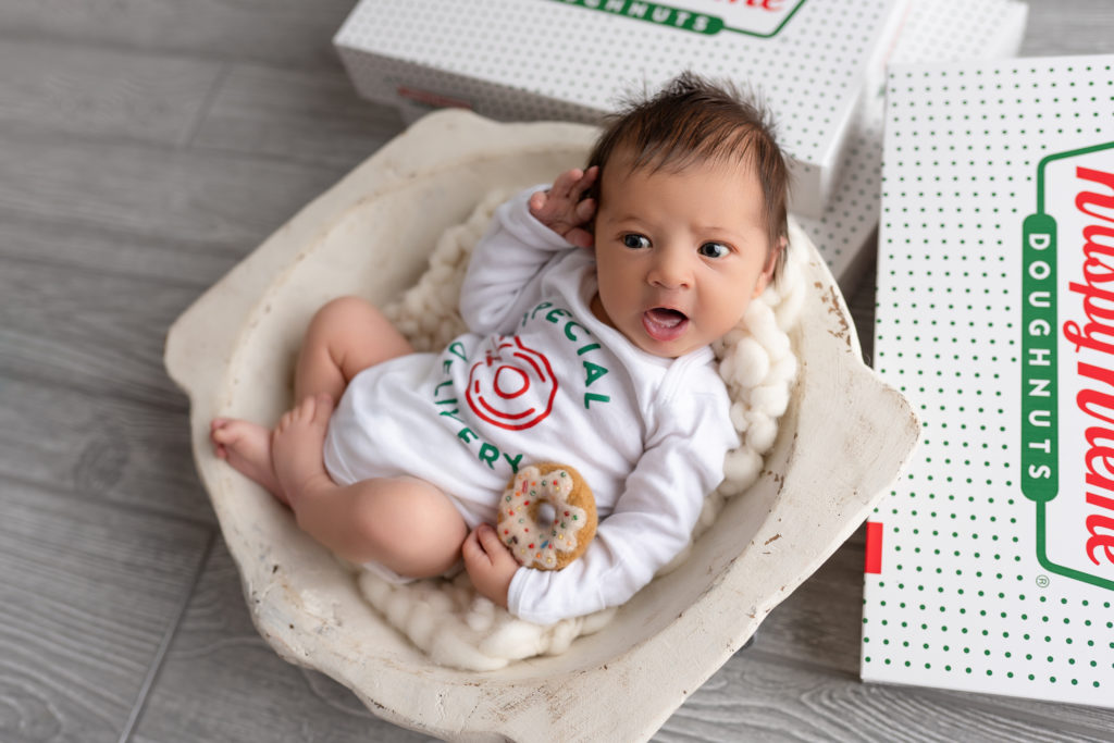 krispy kreme doughnuts setup with newborn baby wide awake