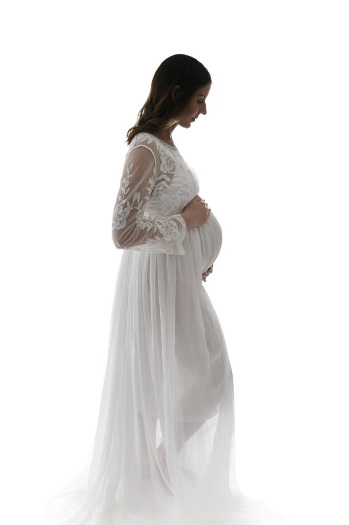 lovely maternity gown on mom in studio Matthews