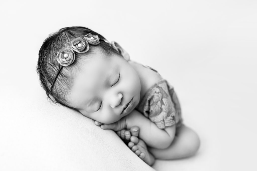 adorable sleeping newborn baby photograph posed in Matthews studio photograph