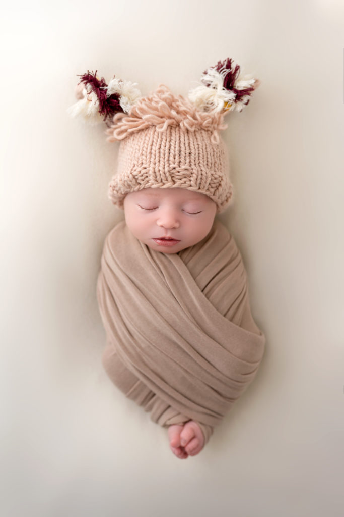 newborn studio session Charlotte baby in llama hat