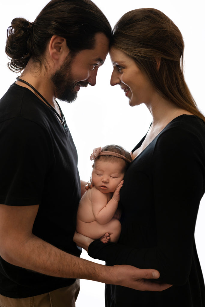 proud new parents with newborn baby girl