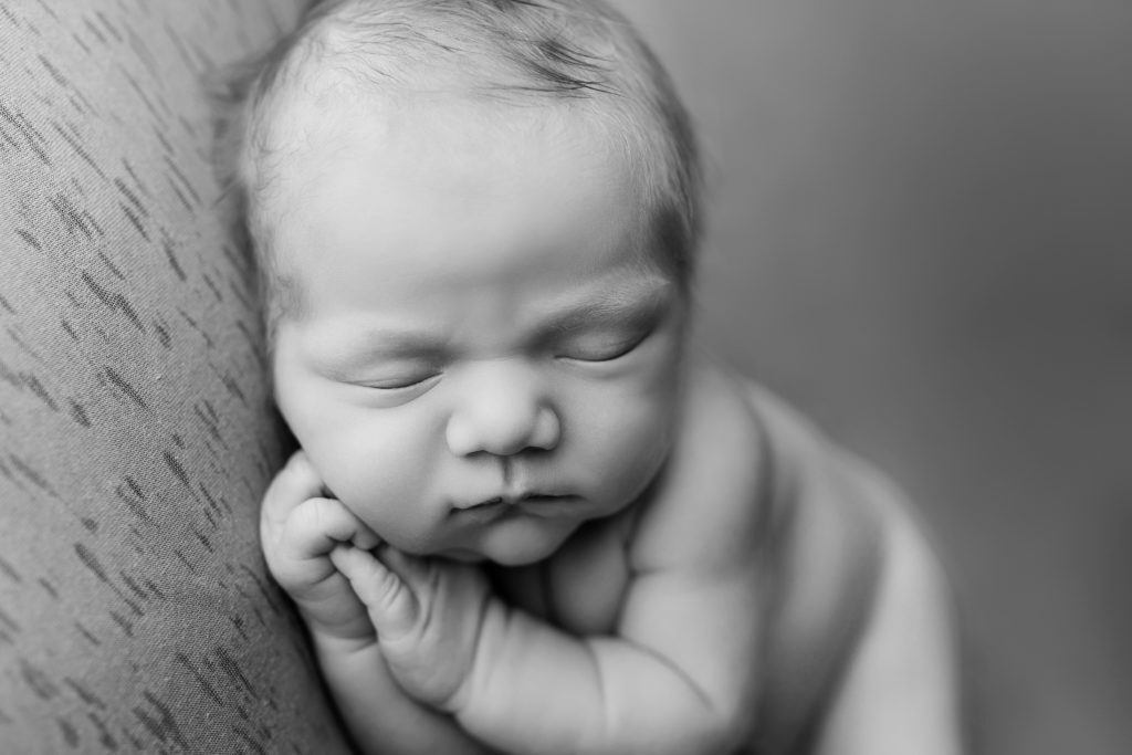 black and white baby boy asleep adorable hands 