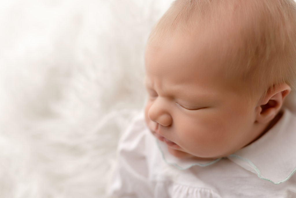 newborn adorable face baby cute white studio