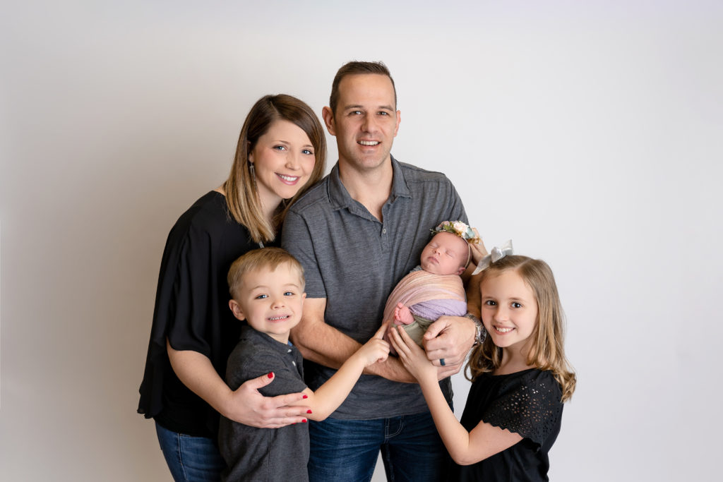 family photograph smiling happy joyous son newborn sister brother