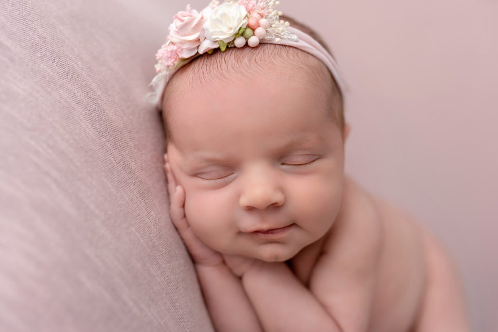 sound asleep newborn precious face adorable white headband flowers
