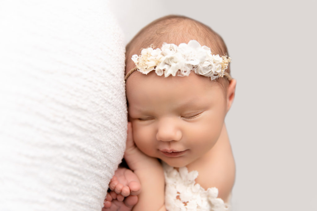 newborn sleeping with headband