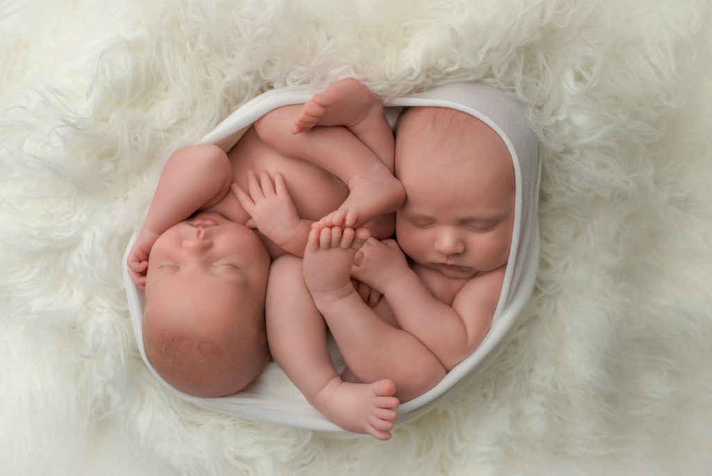 newborn twins in same swaddle