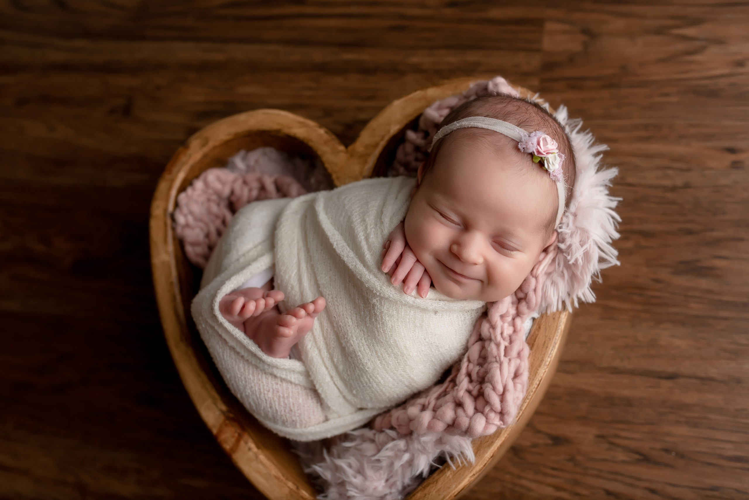 Newborn girl smiling
