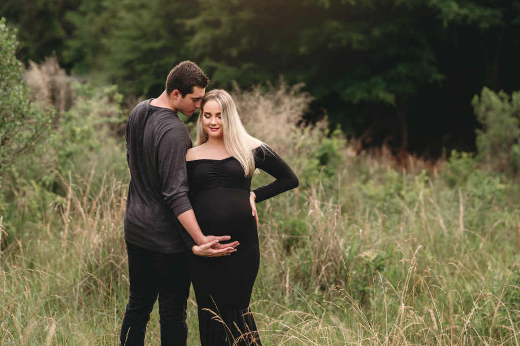maternity photo shoot couple black dress