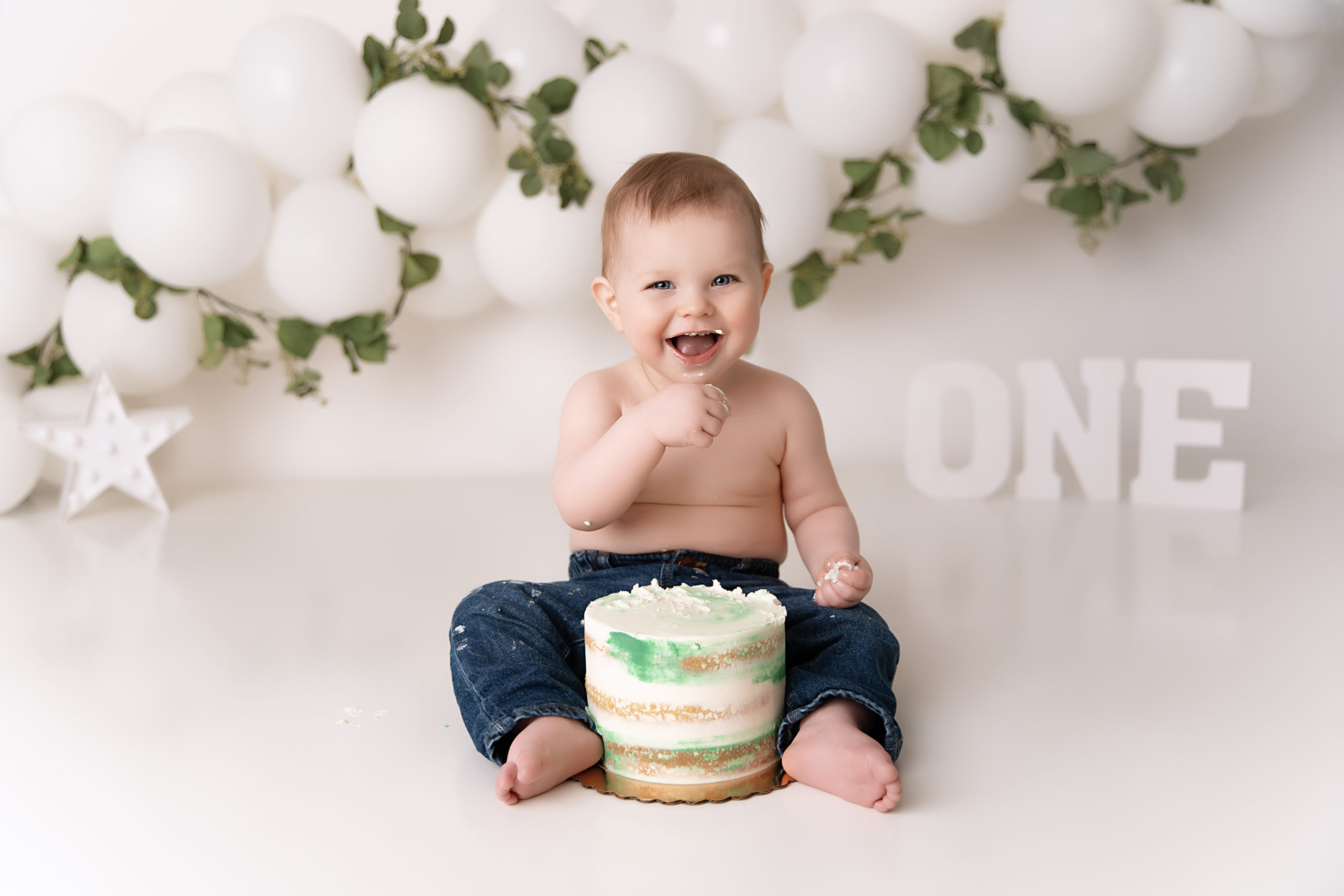 baby boy happy to try smash cake