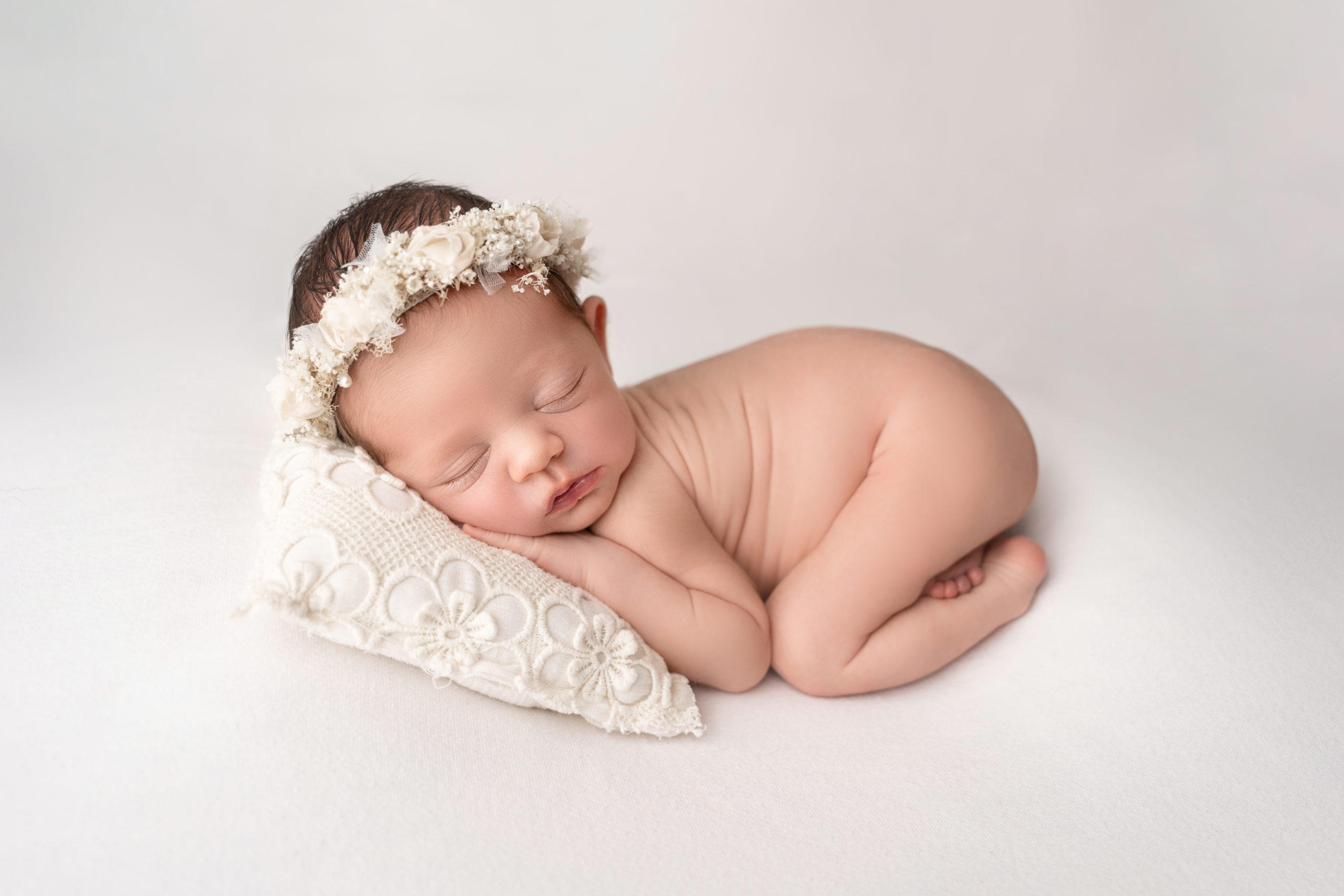 baby girl nude posed bum up with floral headband