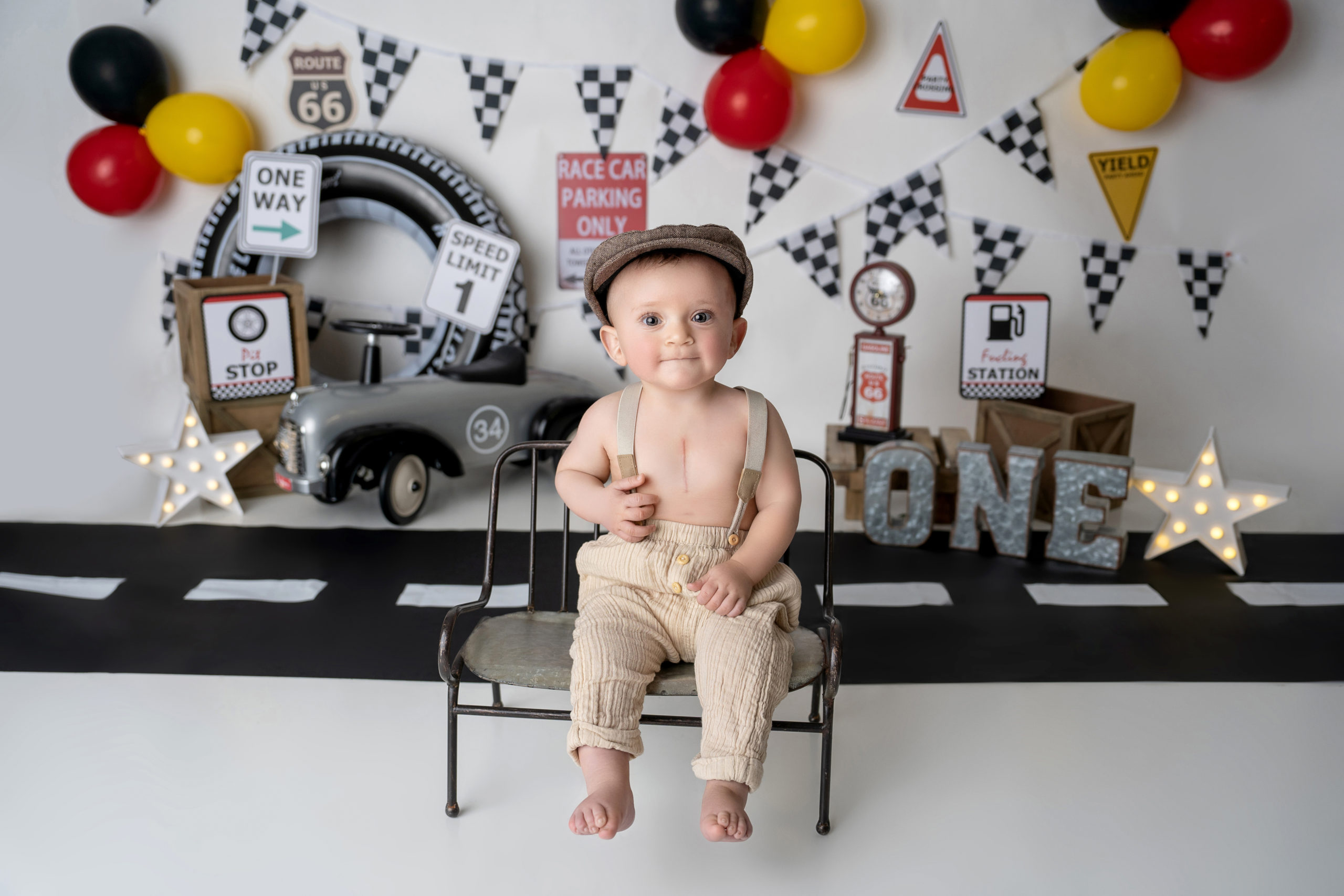 baby boy poses for racecar themed smash