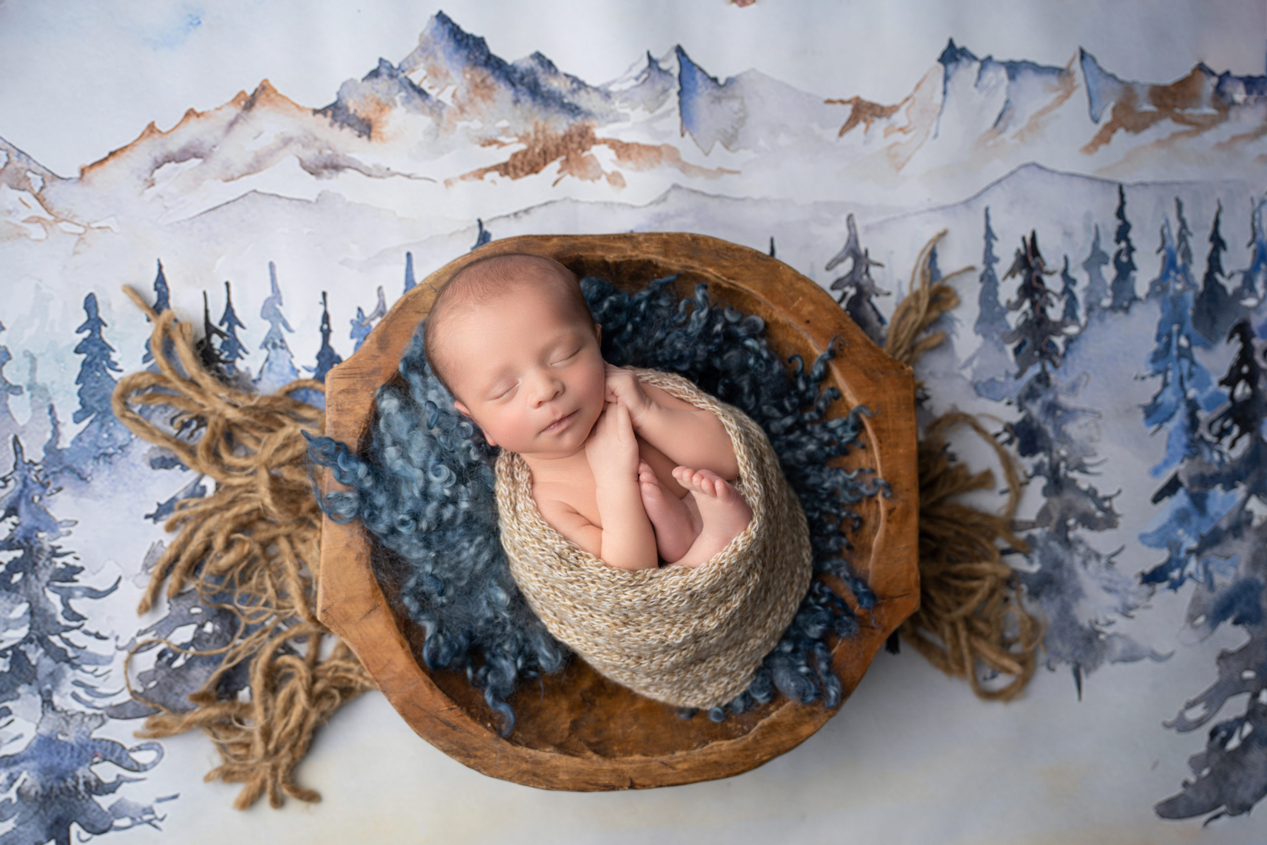 baby boy in blue mountain backdrop