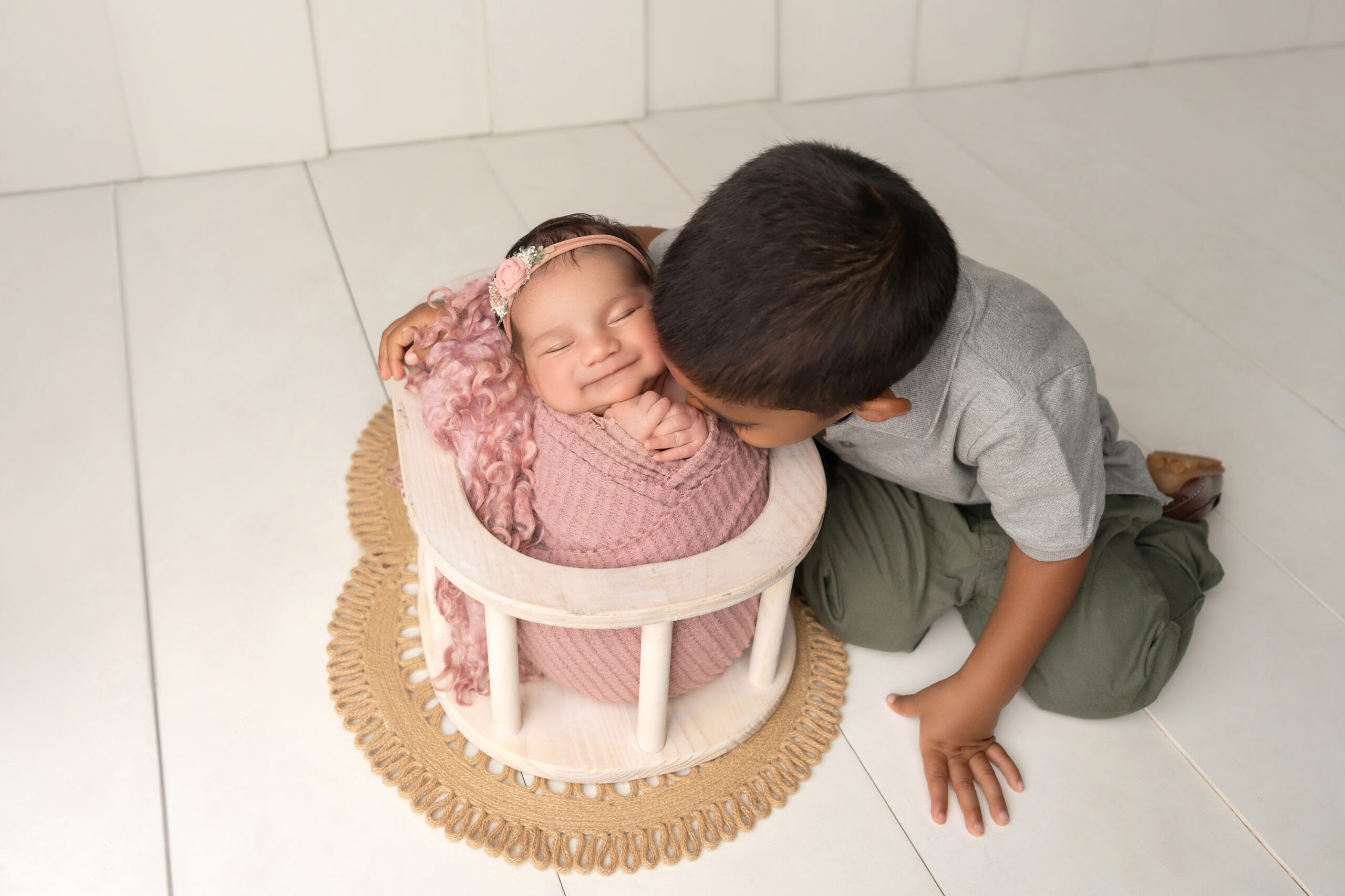 newborn baby girl photo session pink and girly with family and sibling