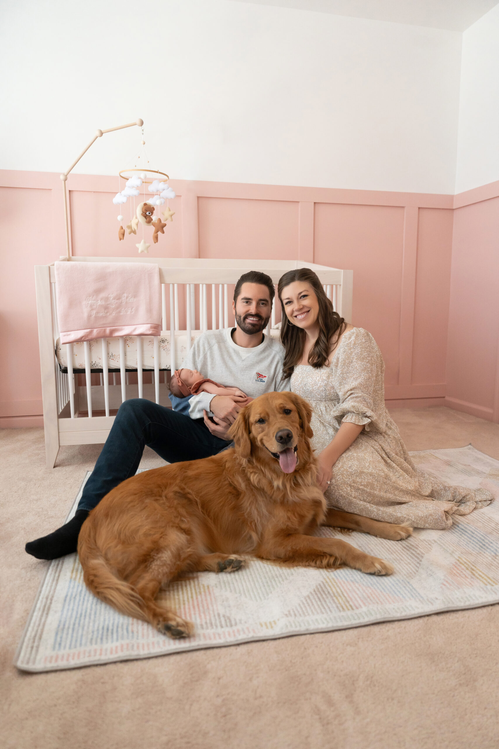 newborn home photoshoot with golden retriever